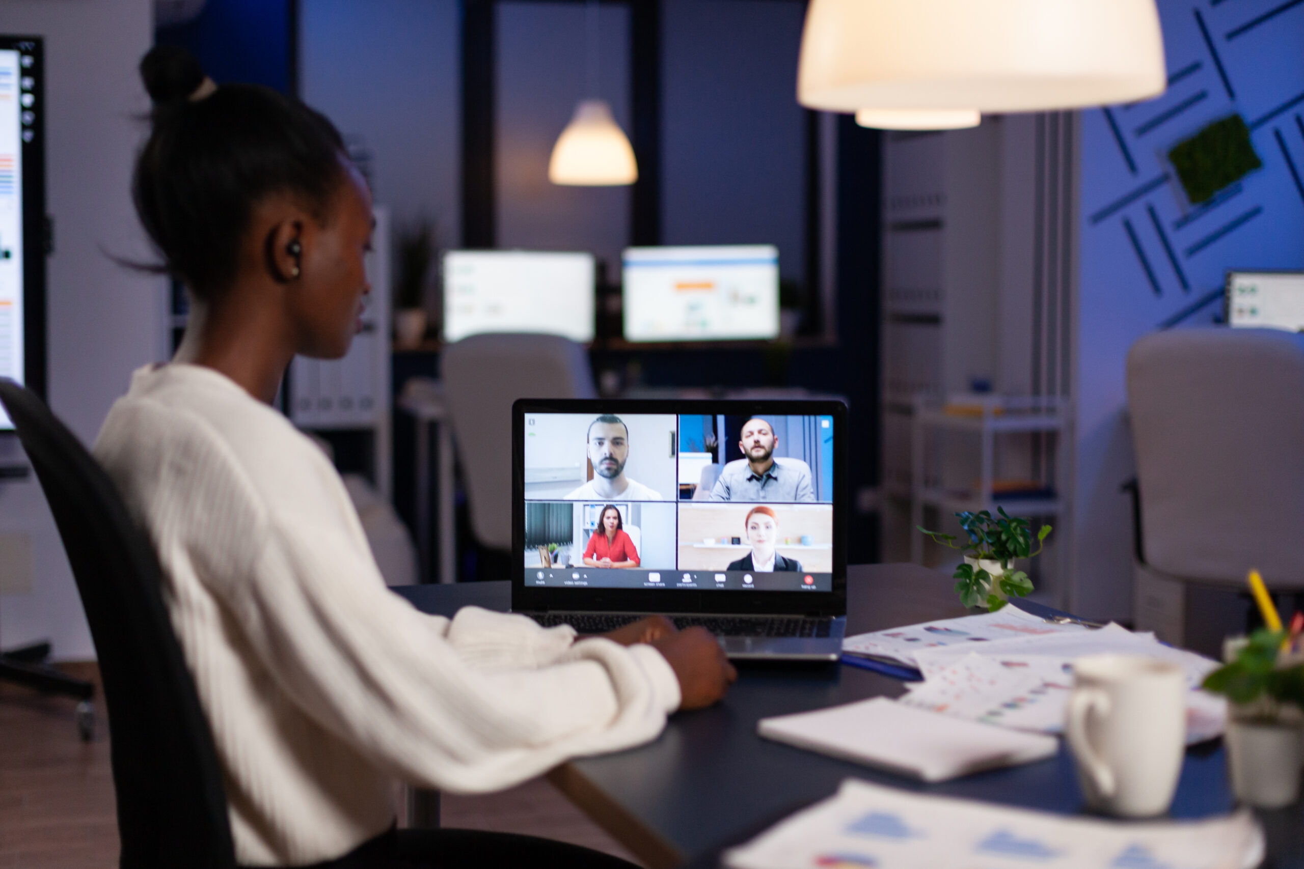 African american businesswoman having online business meeting with remote partners discussing company strategy during videocall conference. Teleconference video call on laptop screen in office